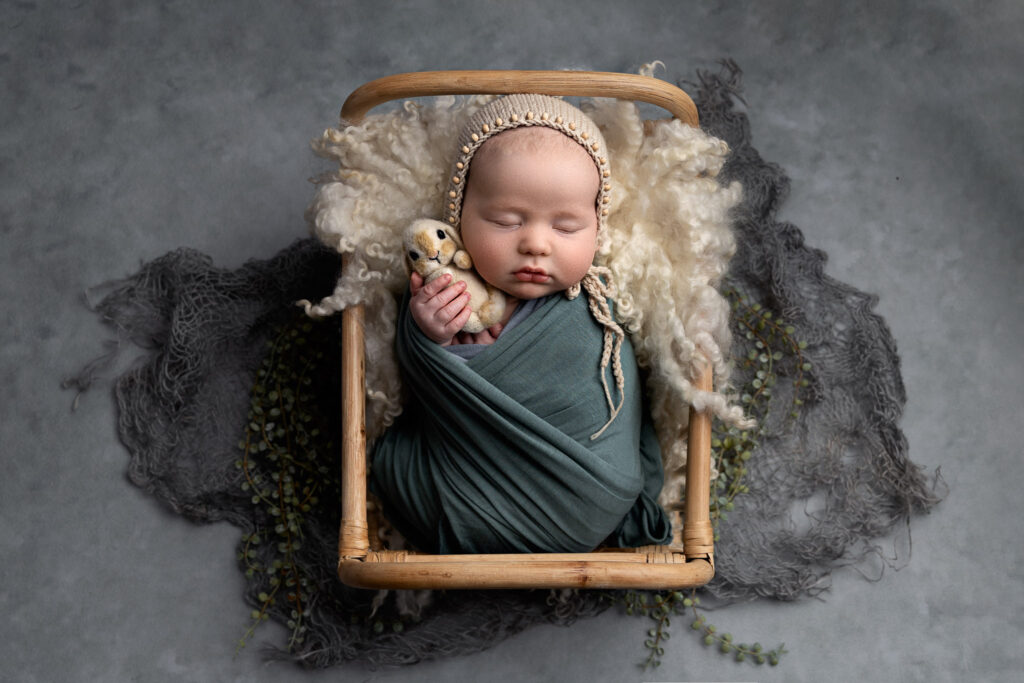 Newborn Photography. Baby in bed.